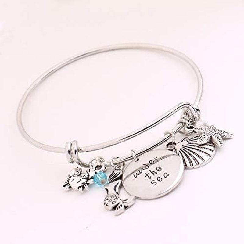 Oceanic Charms: Starfish, Shell, Crab Bangle