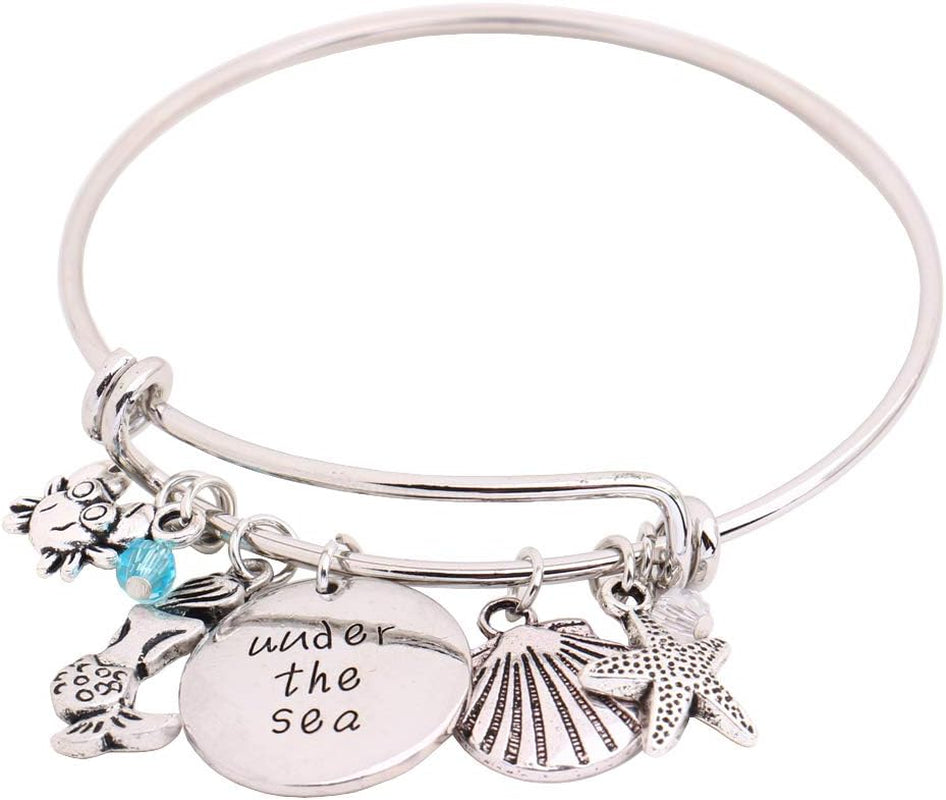 Oceanic Charms: Starfish, Shell, Crab Bangle