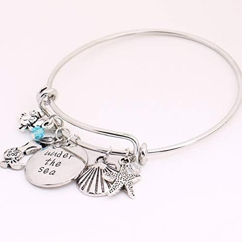 Oceanic Charms: Starfish, Shell, Crab Bangle